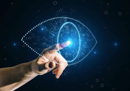 Close,Up,Of,Businessman,Hand,Pointing,At,Glowing,Digital,Polygonal